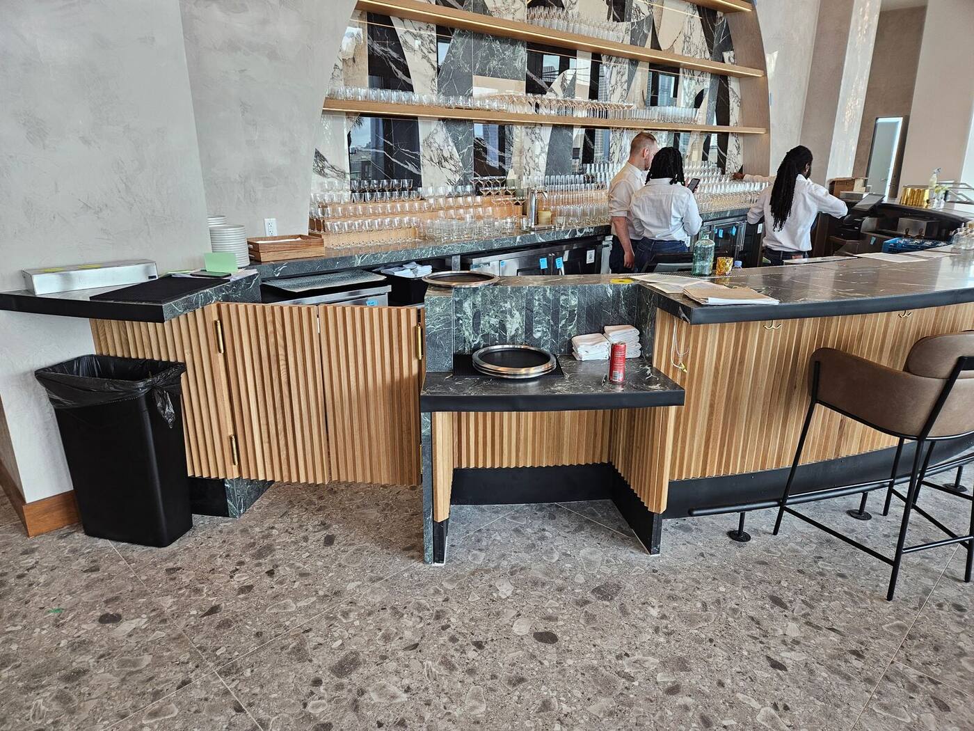 Same hotel bar during final fit-out with loose tops and packaging