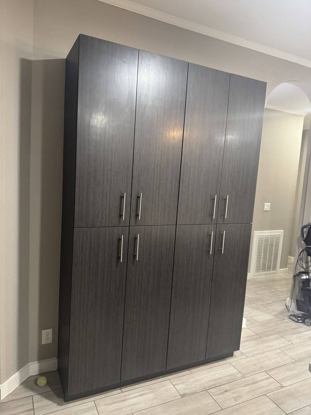 Tall dark pantry cabinet wall closed