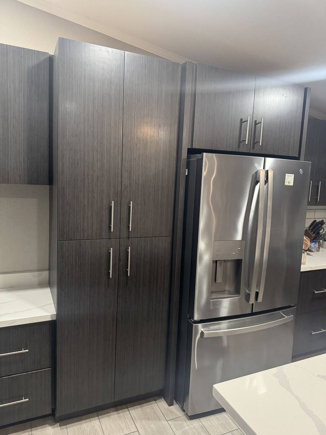 Pantry cabinets open showing adjustable shelving storage