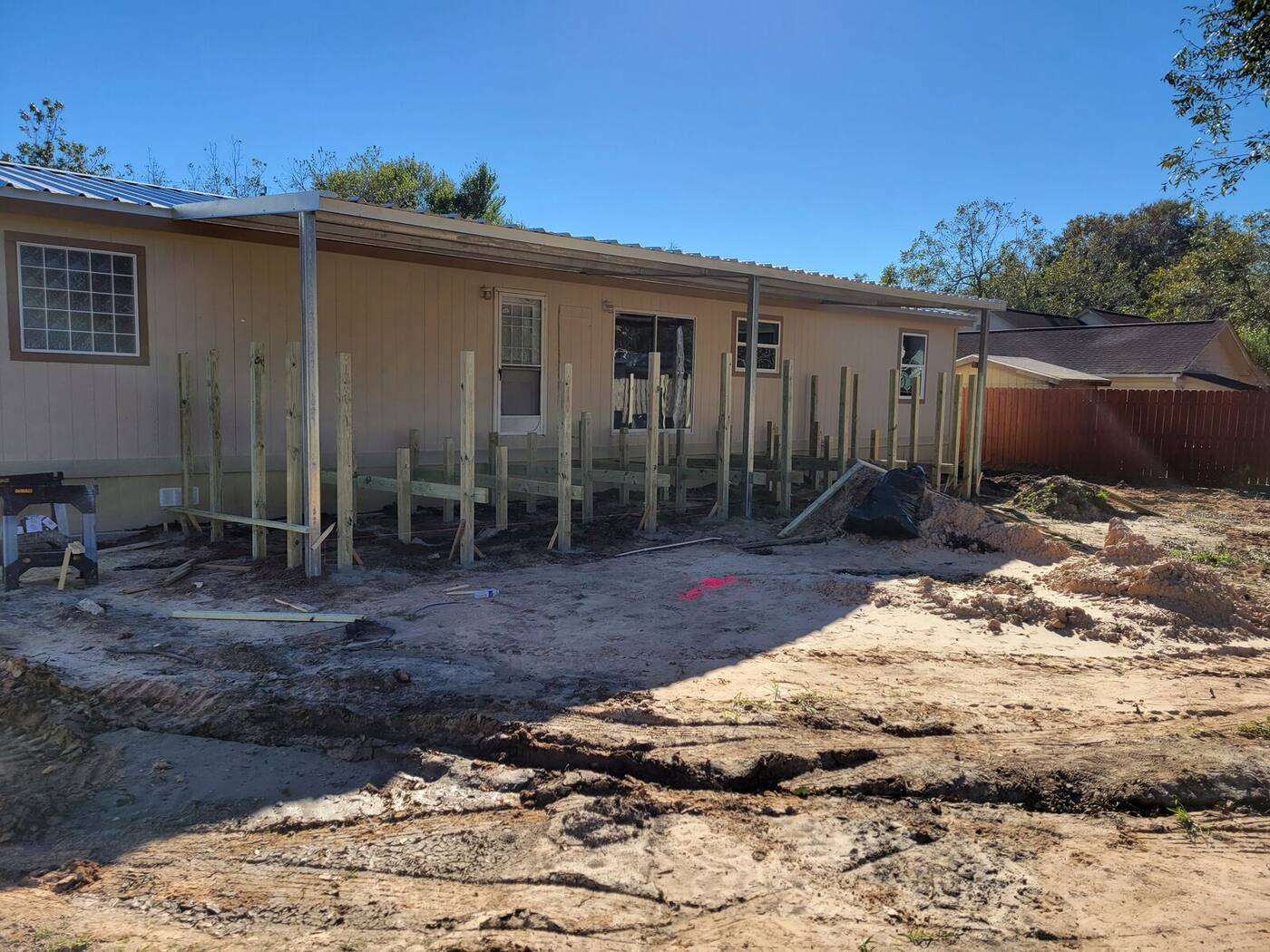 Deck posts and framing at start of porch build